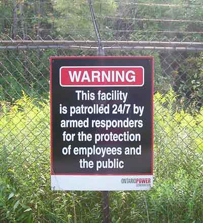 Sign on power station: Warning Armed Responders